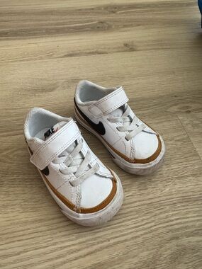 Nike Kids White Sneakers with Brown Trim and Black Swoosh